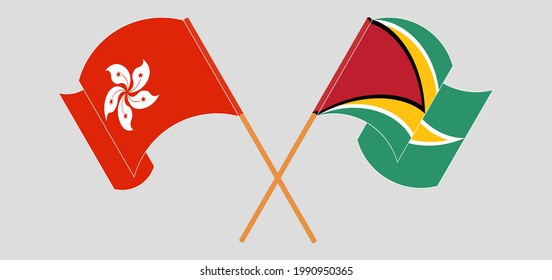 Crossed and waving flags of Hong Kong and Guyana