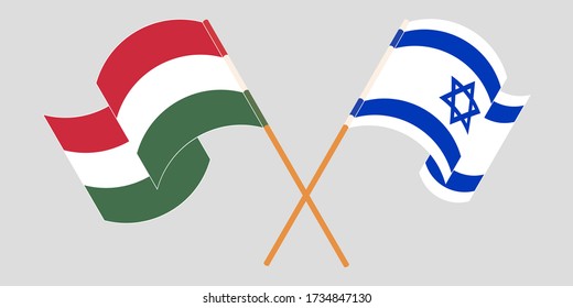 Crossed and waving flags of Hungary and Israel