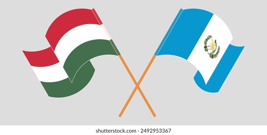Crossed and waving flags of Hungary and Republic of Guatemala. Vector illustration
