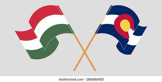 Cruzados y ondeando banderas de Hungría y el estado de Colorado