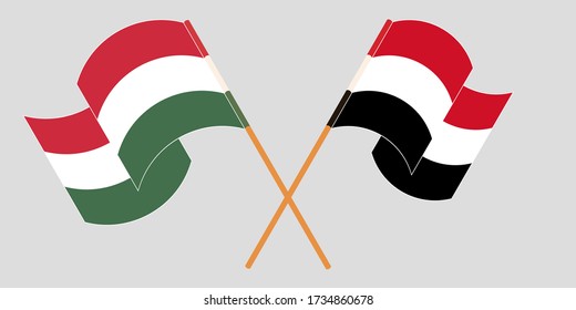 Crossed and waving flags of Hungary and Yemen