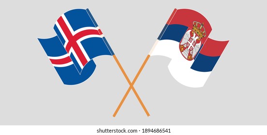 Crossed and waving flags of Iceland and Serbia