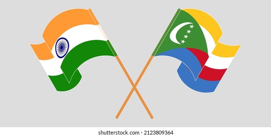 Crossed and waving flags of India and Comoros. Vector illustration
