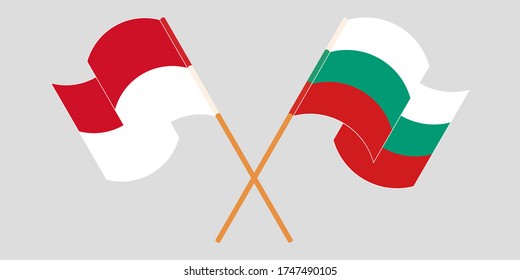 Crossed and waving flags of Indonesia and Bulgaria