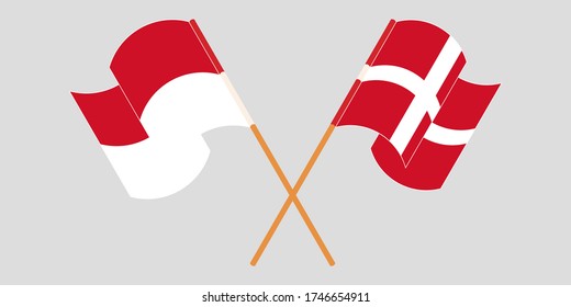 Banderas cruzadas y ondeando banderas de Indonesia y Dinamarca