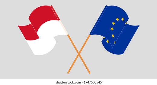 Banderas cruzadas y ondeando banderas de Indonesia y la Unión Europea