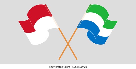 Crossed and waving flags of Indonesia and Sierra Leone