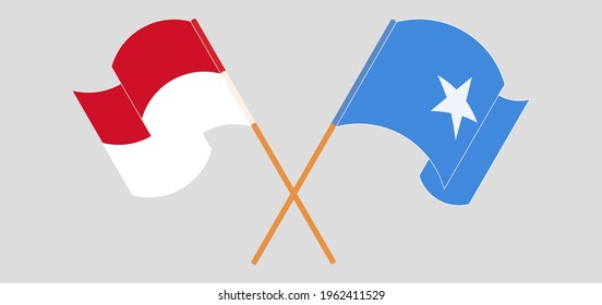 Crossed and waving flags of Indonesia and Somalia