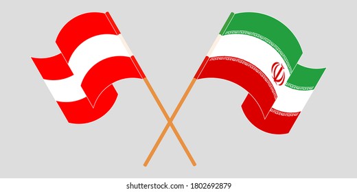 Banderas cruzadas y ondeando banderas de Irán y Austria
