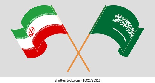 Crossed and waving flags of Iran and the Kingdom of Saudi Arabia