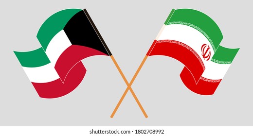 Banderas cruzadas y ondeando banderas de Irán y Kuwait