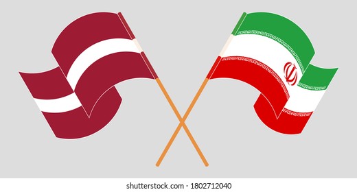 Crossed and waving flags of Iran and Latvia