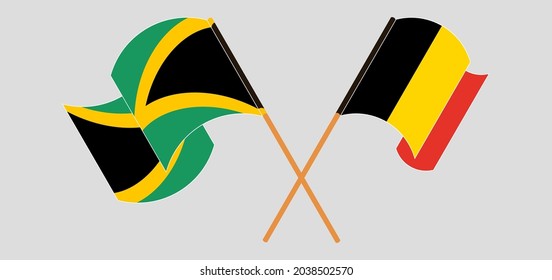 Crossed and waving flags of Jamaica and Belgium