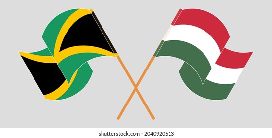 Crossed and waving flags of Jamaica and Hungary