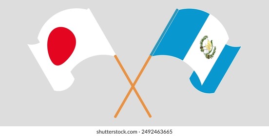 Crossed and waving flags of Japan and Republic of Guatemala. Vector illustration
