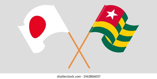 Crossed and waving flags of Japan and Togo