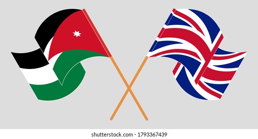 Crossed and waving flags of Jordan and the UK