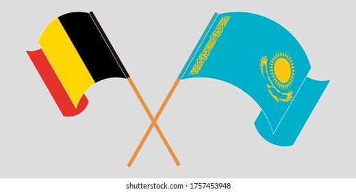Crossed and waving flags of Kazakhstan and Belgium