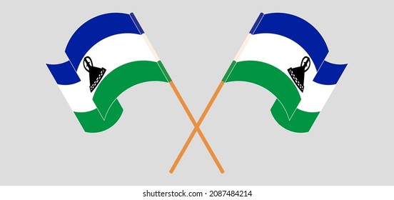 Crossed and waving flags of Kingdom of Lesotho. Vector illustration
