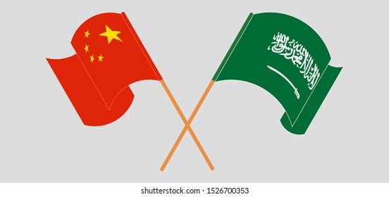 Crossed and waving flags of Kingdom of Saudi Arabia and China