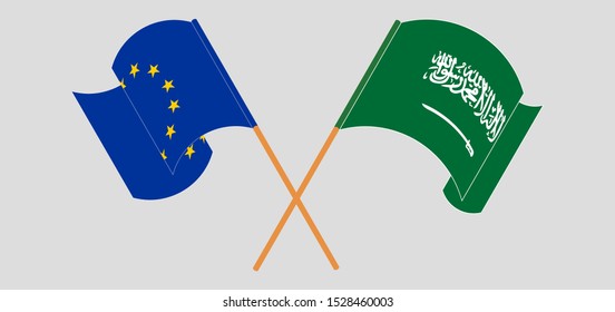 Crossed and waving flags of the Kingdom of Saudi Arabia and the EU