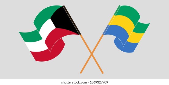 Crossed and waving flags of Kuwait and Gabon