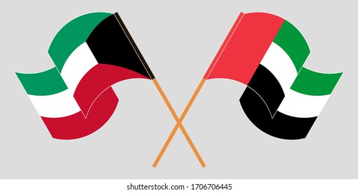 Crossed and waving flags of Kuwait and the United Arab Emirates