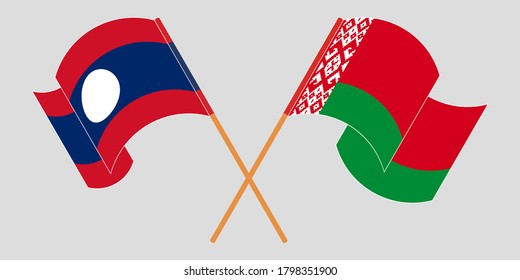 Crossed and waving flags of Laos and Belarus