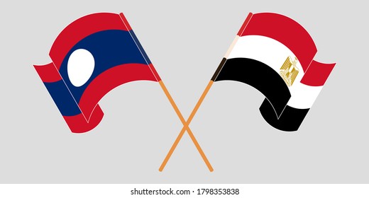 Cruzados y ondeando banderas de Laos y Egipto
