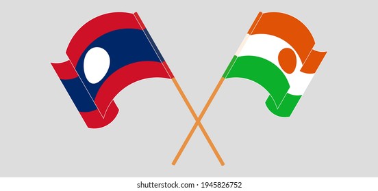 Banderas cruzadas y ondeando banderas de Laos y Níger