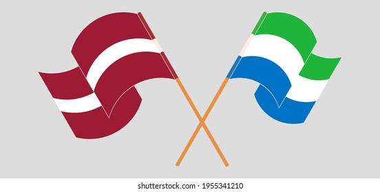 Crossed and waving flags of Latvia and Sierra Leone