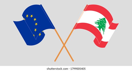 Banderas cruzadas y ondeando banderas del Líbano y de la Unión Europea