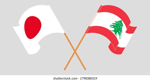 Crossed and waving flags of Lebanon and Japan