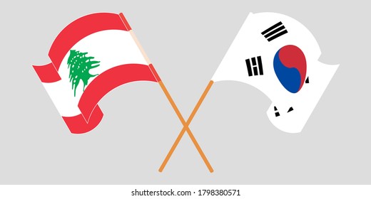 Crossed and waving flags of Lebanon and South Korea