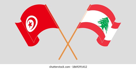 Crossed and waving flags of Lebanon and Tunisia