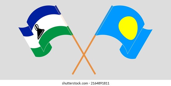 Crossed and waving flags of Lesotho and Palau. Vector illustration
