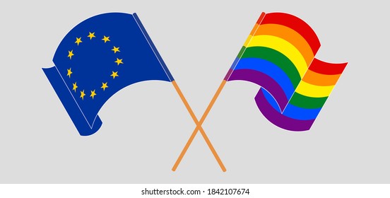 Crossed and waving flags of LGBTQ and the EU