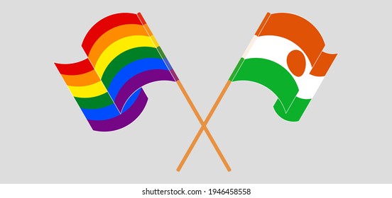 Crossed and waving flags of LGBTQ and Niger