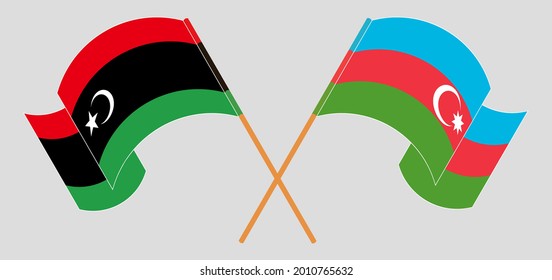 Crossed and waving flags of Libya and Azerbaijan