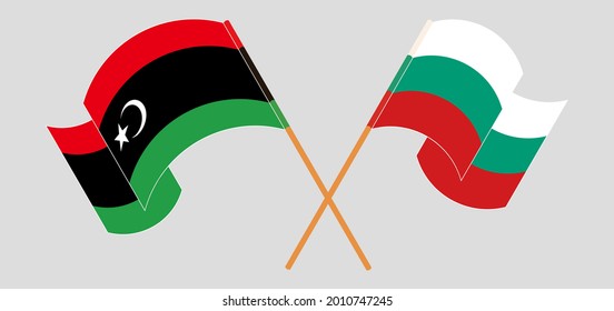 Gekreuzte und wehende Flaggen Libyens und Bulgariens