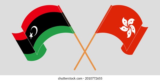 Banderas cruzadas y ondeando banderas de Libia y Hong Kong