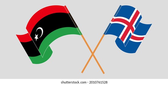 Crossed and waving flags of Libya and Iceland