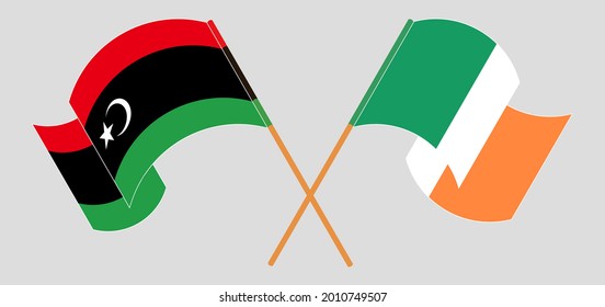 Banderas cruzadas y ondeando banderas de Libia e Irlanda