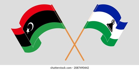 Crossed and waving flags of Libya and Kingdom of Lesotho. Vector illustration
