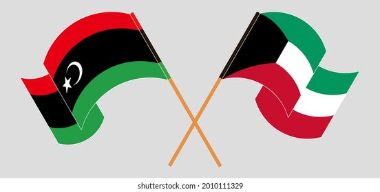 Gekreuzte und wehende Flaggen Libyens und Kuwaits