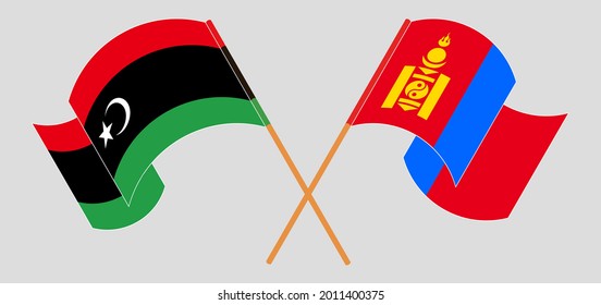 Crossed and waving flags of Libya and Mongolia