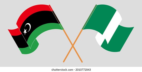 Crossed and waving flags of Libya and Nigeria