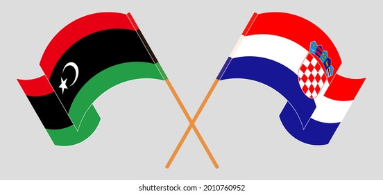 Cruzada y ondeando banderas de Libia y Eslovenia