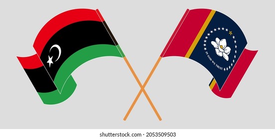 Crossed and waving flags of Libya and the State of Mississippi
