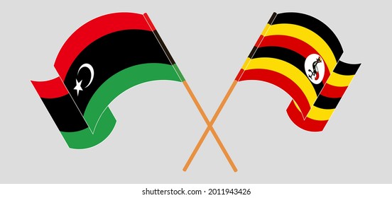 Cruzada y ondeando banderas de Libia y Uganda